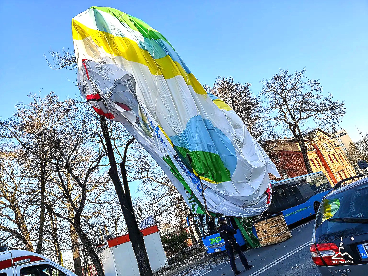 A 28-year-old woman has died after falling from a hot air balloon onto a rooftop in Poland after the balloon struck a block of flats - two others survived with minor injuries.