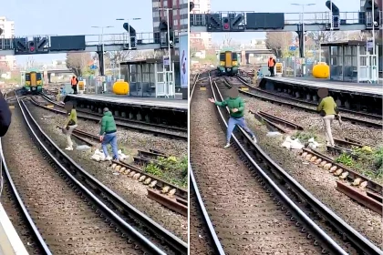 Shocking footage shows two men walking on train tracks near a live rail at East Croydon, risking electrocution as stunned passengers watch a dangerous near miss unfold