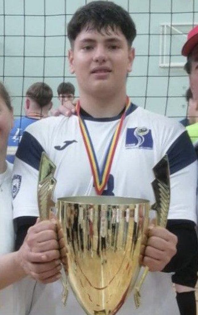 An 18-year-old volleyball player died after being struck by a train while wearing headphones, with early reports suggesting he didn’t hear it as investigations continue.