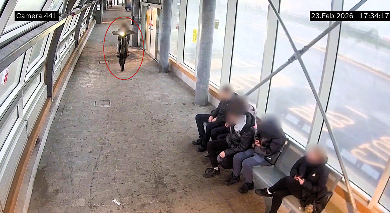 Wild youths caught on CCTV doing wheelies on e-bikes through a busy bus station in Wales - narrowly missing commuters before police seized one of the bikes. Watch the clip.