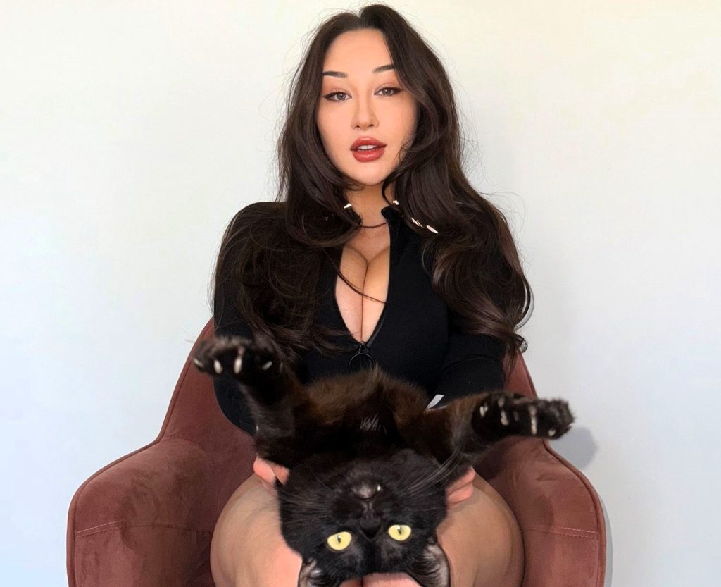 Influencer Louisa Khovanski spent £22,000 to save her rescue cat Morty after vets warned he might not survive - now dubbed a miracle cat after a dramatic recovery from the brink.