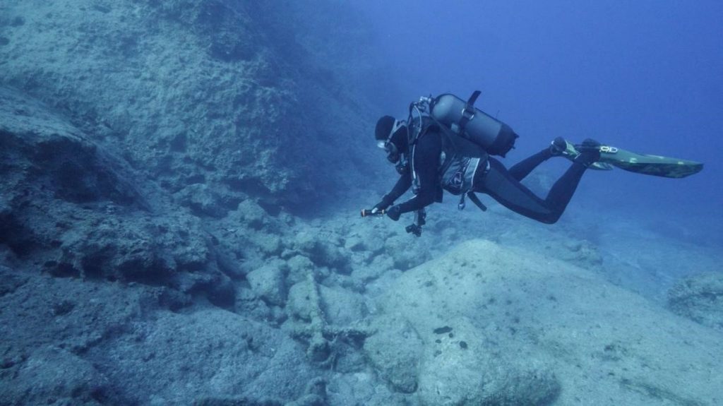 A shipwreck graveyard spanning more than 2,600 years has been discovered off a Greek island - with five ancient wrecks and dozens of artefacts found buried beneath the sea.
