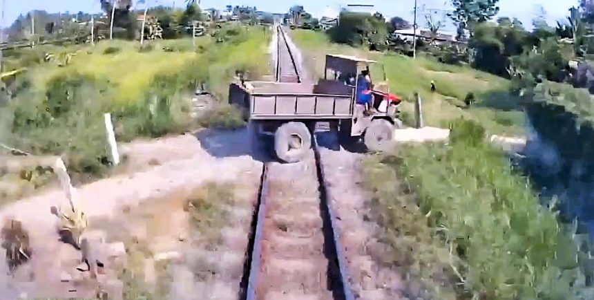 Dashcam footage captured a 10-year-old boy being hurled into the air when a train struck a farm vehicle at an unofficial, unguarded level crossing in Vietnam, killing the child.