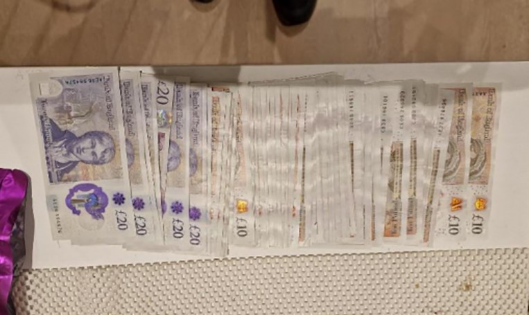A drug dealer is caught with thousands in cash after giving a flimsy excuse at a train station, with police later uncovering a £35,000 cannabis stash at his home.