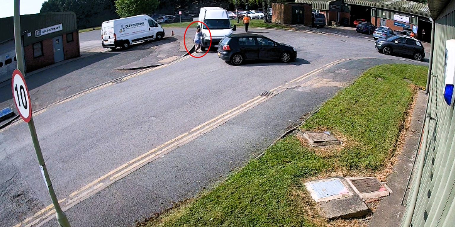 A business owner was deliberately knocked down by a white van after confronting thieves who had raided her premises in Oswestry, leaving her and her partner with injuries.