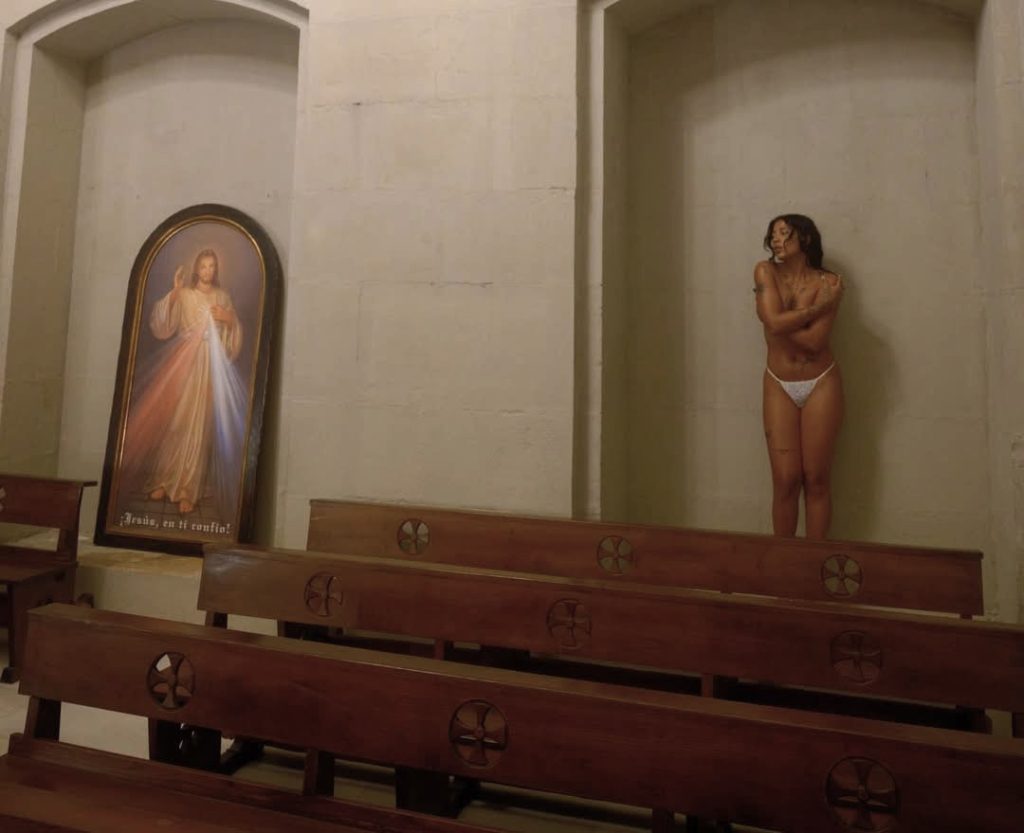 Dominican rapper Tokischa sparked outrage after filming a provocative music video inside a Spanish basilica, prompting the diocese to demand removal and consider legal action.