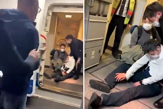 Two drunk aviation bosses who forced their way onto a plane and upgraded themselves to first class have been sacked and removed from the Communist Party after a cover-up lasting nearly two years.