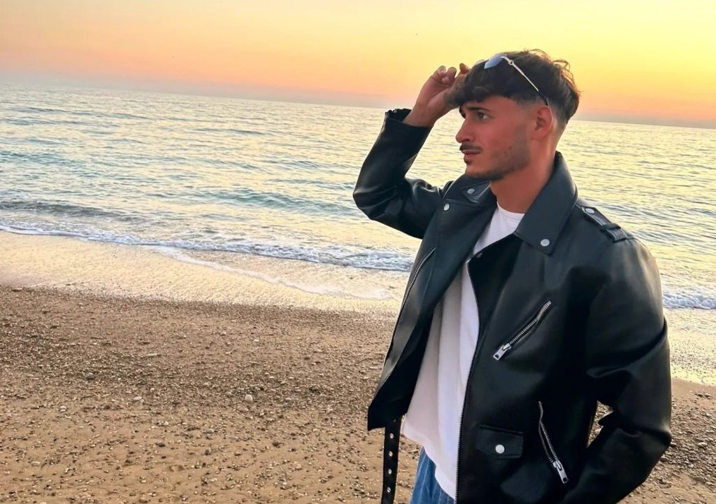 A footballer was allegedly stabbed to death with a screwdriver by a teenager who tried to steal the pizzas he was carrying while walking back to his car.