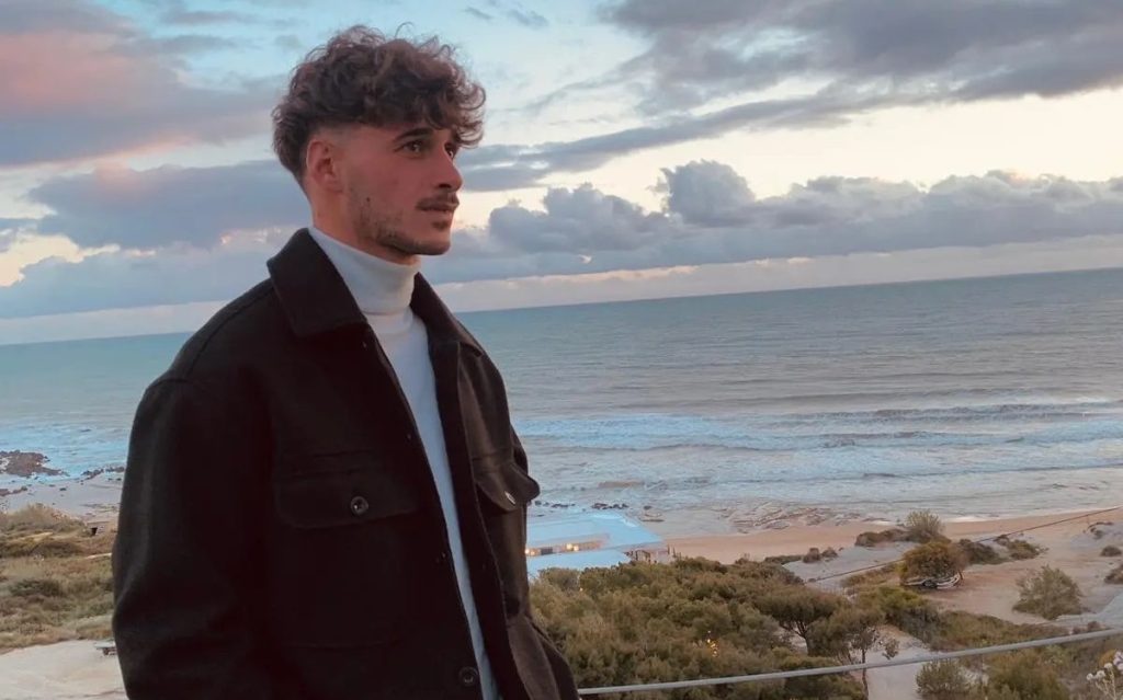 A footballer was allegedly stabbed to death with a screwdriver by a teenager who tried to steal the pizzas he was carrying while walking back to his car.