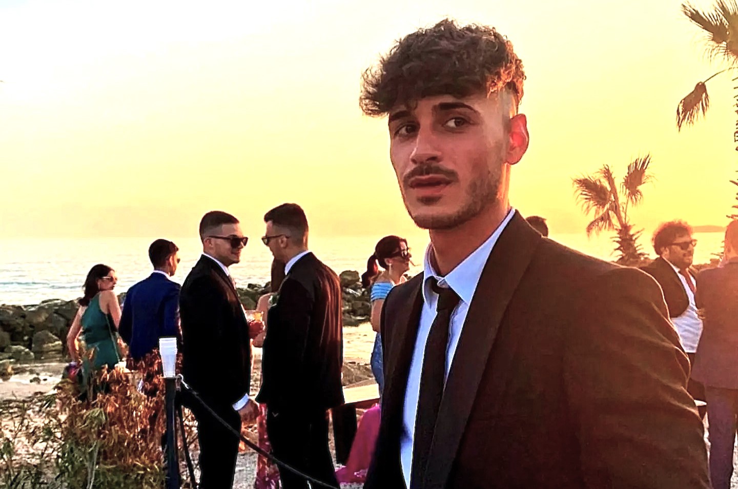 A footballer was allegedly stabbed to death with a screwdriver by a teenager who tried to steal the pizzas he was carrying while walking back to his car.