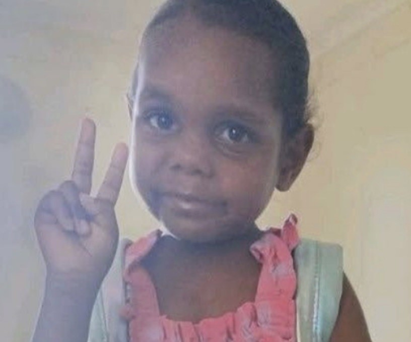A five-year-old girl found dead near Alice Springs has been declared a homicide, with police urgently hunting a 47-year-old man known to the child as their prime person of interest.