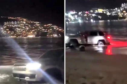 Clueless tourists sparked mockery online after getting their SUV hopelessly stuck in the sand on a Mexican beach at night, with waves lapping at the stranded vehicle.