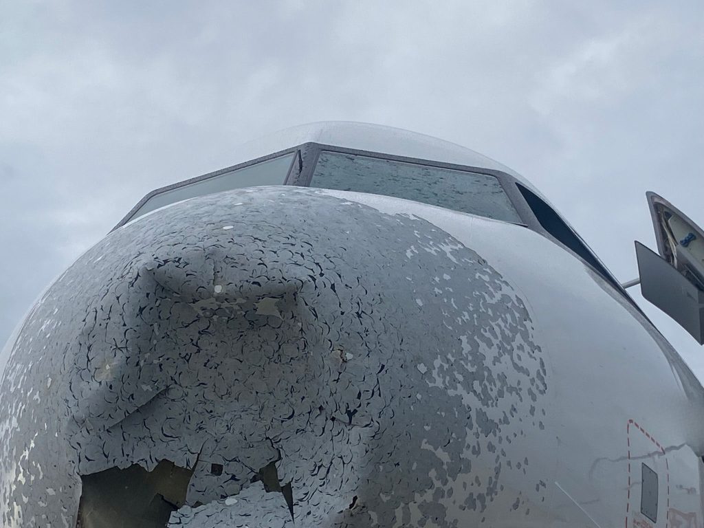An Airbus A320 was left with a gaping hole in its nose and severe structural damage after flying into a violent hailstorm over Poland - but all passengers and crew escaped without injury.