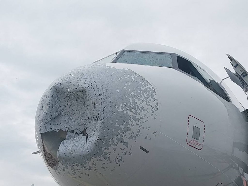 An Airbus A320 was left with a gaping hole in its nose and severe structural damage after flying into a violent hailstorm over Poland - but all passengers and crew escaped without injury.