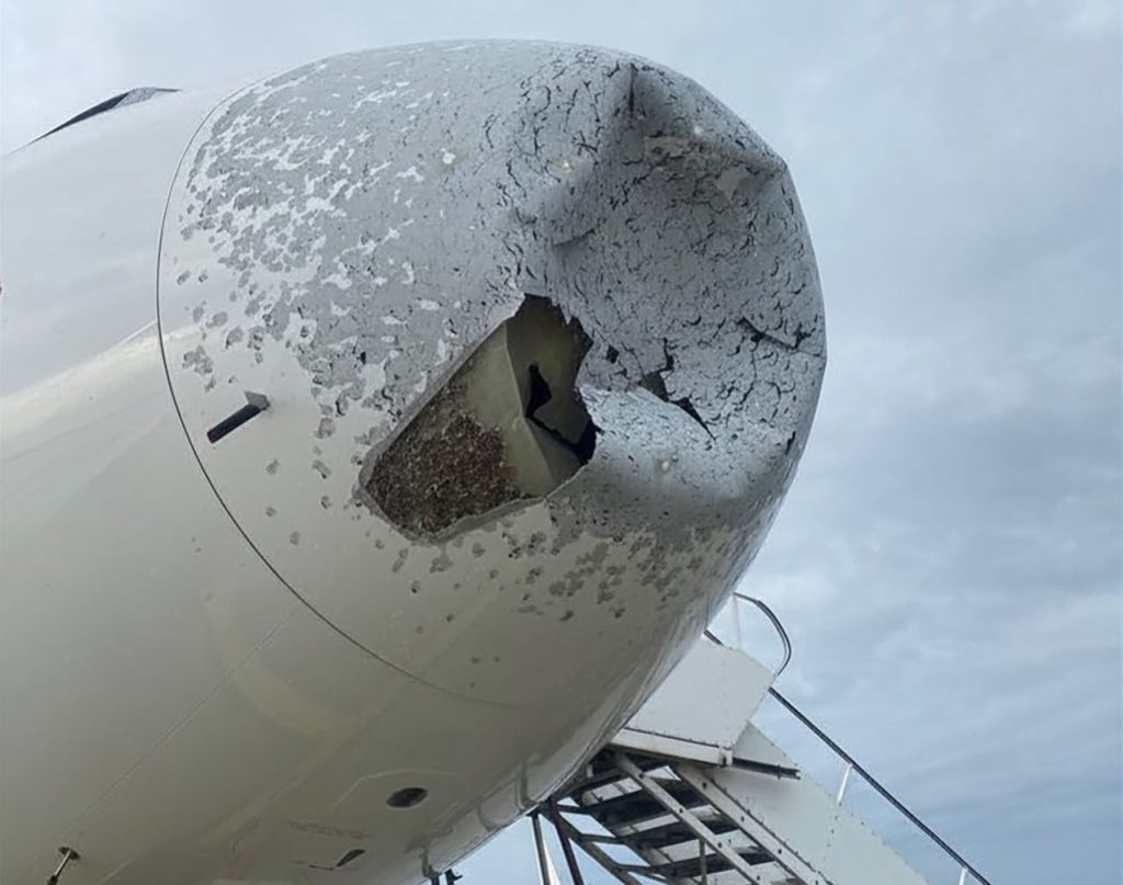 An Airbus A320 was left with a gaping hole in its nose and severe structural damage after flying into a violent hailstorm over Poland - but all passengers and crew escaped without injury.