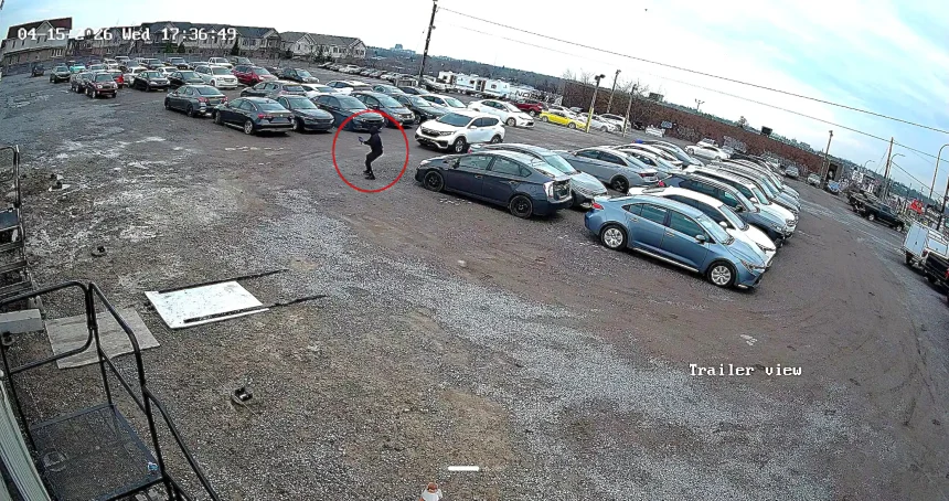 A masked gunman fired 16 shots at a Canadian car dealership in broad daylight before fleeing in a waiting Honda, with police offering a reward for information on the suspects.