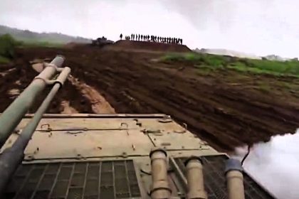 Soldier accidentally fires a smoke grenade at senior military officials during a training exercise - sending them scrambling as the leaked helmet cam footage goes viral.