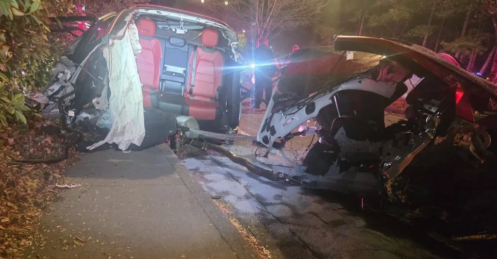 Porsche torn completely in half after smashing into a tree in a horror crash - but the driver miraculously walked away with only minor injuries. Speed suspected as the cause.