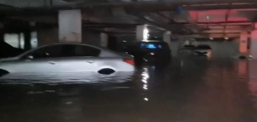 More than 100 cars were left submerged and streets turned into flood zones after the strongest rainstorm in a decade struck the city of Qinzhou in China.