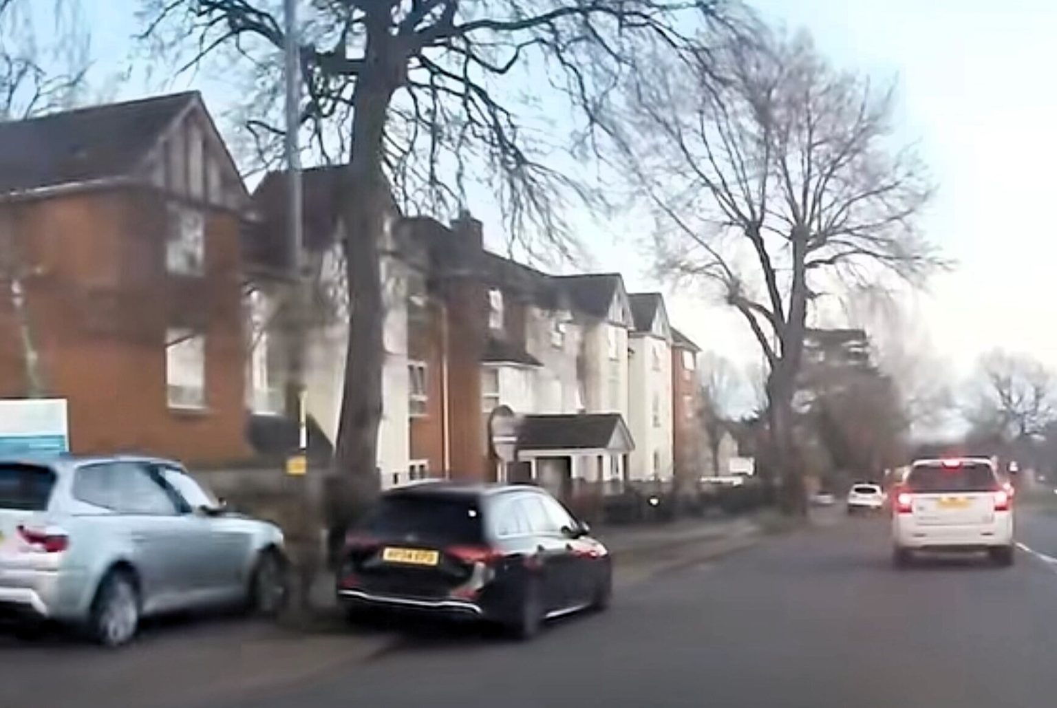 A reckless driver is caught on camera mounting the pavement and speeding along a footpath to dodge traffic, sparking outrage over the dangerous stunt in a busy area.