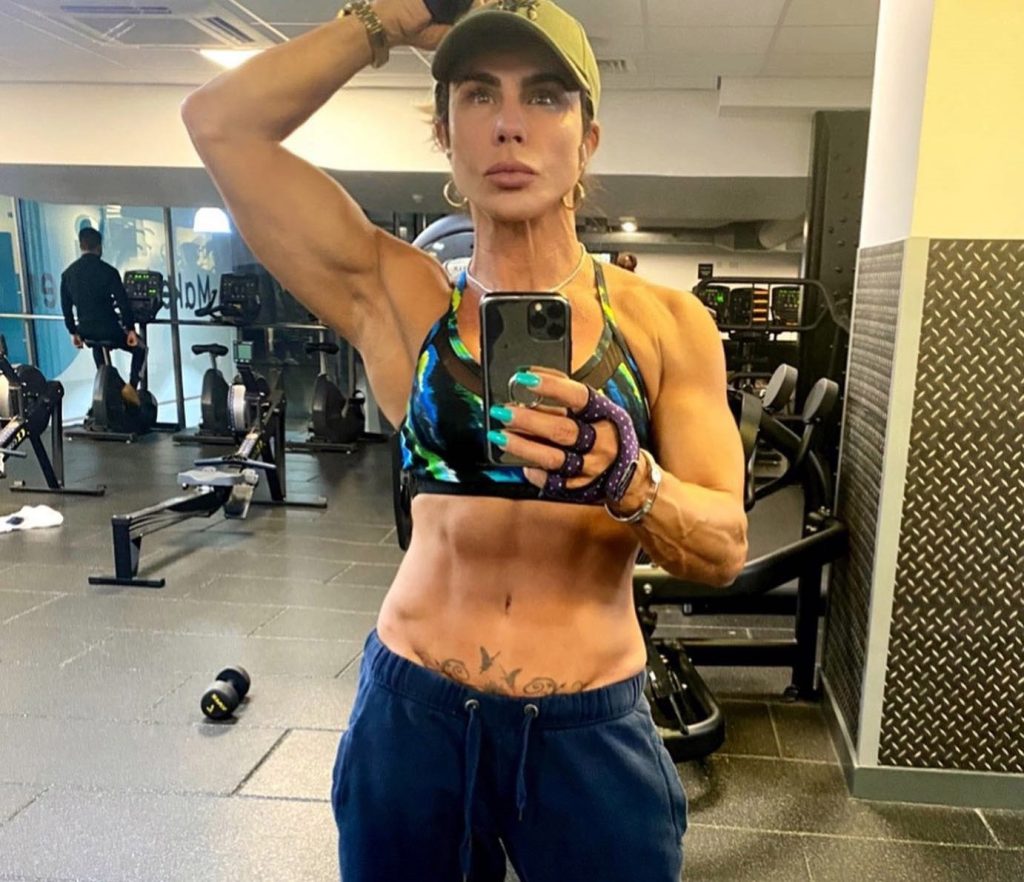 Fit gran aged 56 with over 480,000 followers says she is not chasing youth - and hints her libido is still going strong as she stuns fans posing in nothing but a towel.