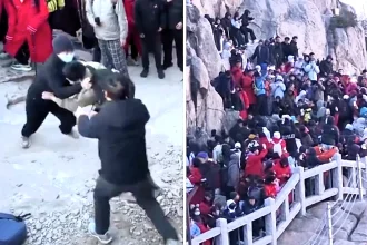 A sunrise viewing spot in China descended into chaos as tourists armed with selfie sticks brawled on a steep rock face while jostling for the best vantage points at a packed beauty spot.