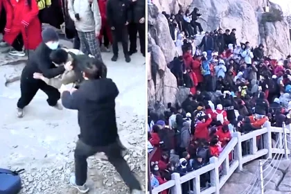 A sunrise viewing spot in China descended into chaos as tourists armed with selfie sticks brawled on a steep rock face while jostling for the best vantage points at a packed beauty spot.