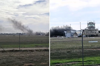 Two people died and more than a dozen were injured after a light aircraft nosedived into a hangar at Parafield Airport in Adelaide, sparking a massive blaze visible for miles.