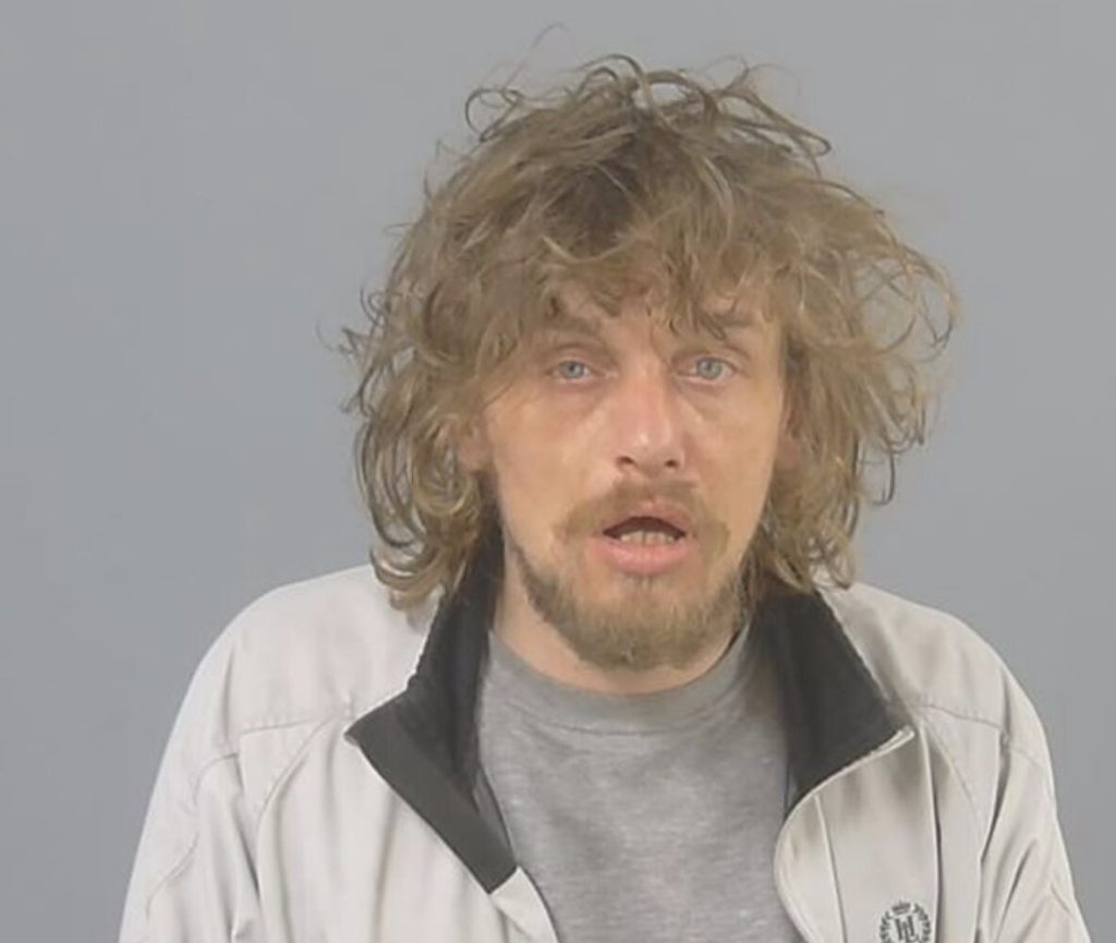 A volatile thief who threatened supermarket staff with needles and a wine bottle during a terrifying robbery has been jailed for 22 months after pleading guilty.
