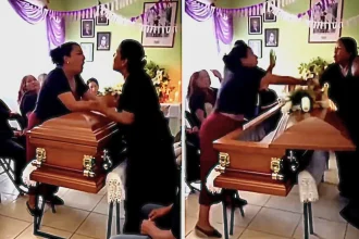 Two women brawled beside a coffin at a Mexican wake after discovering they were both lovers of the same man, nearly knocking the lid off in the shocking viral clash.