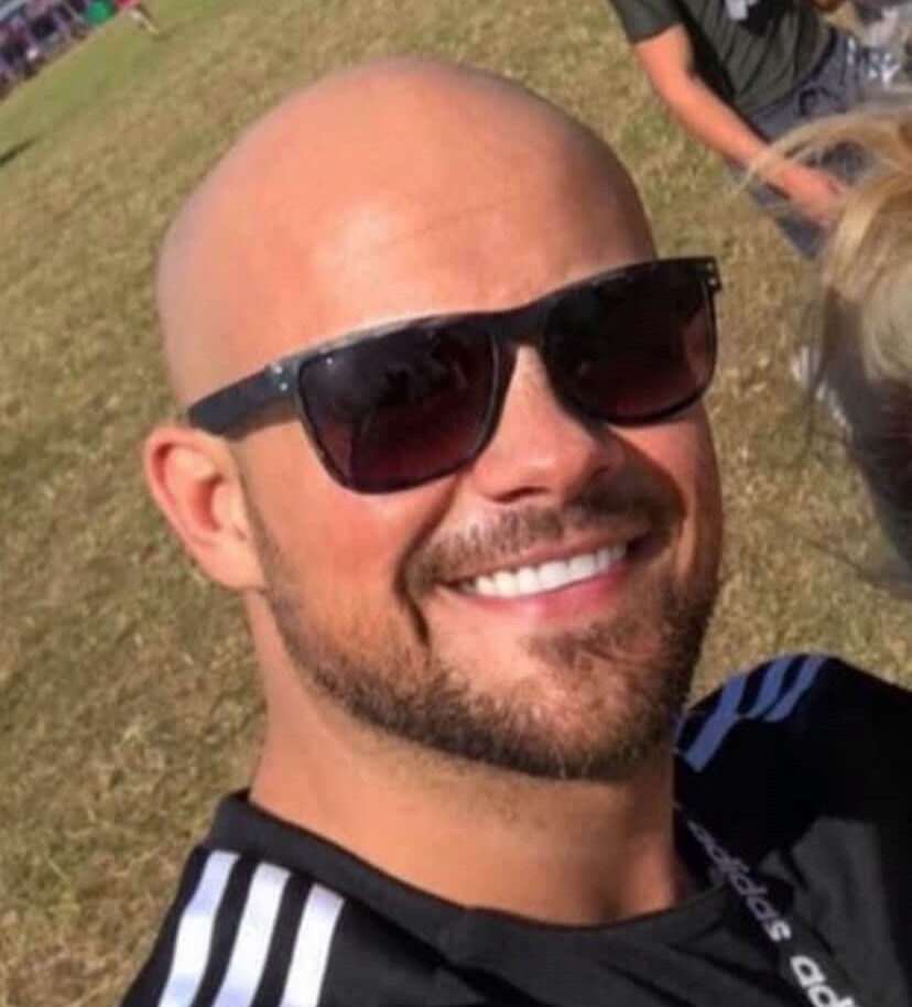 A comedian is hailed a hero after bravely stepping in to stop a violent street fight in Newcastle, restraining the attacker as shocked crowds looked on.