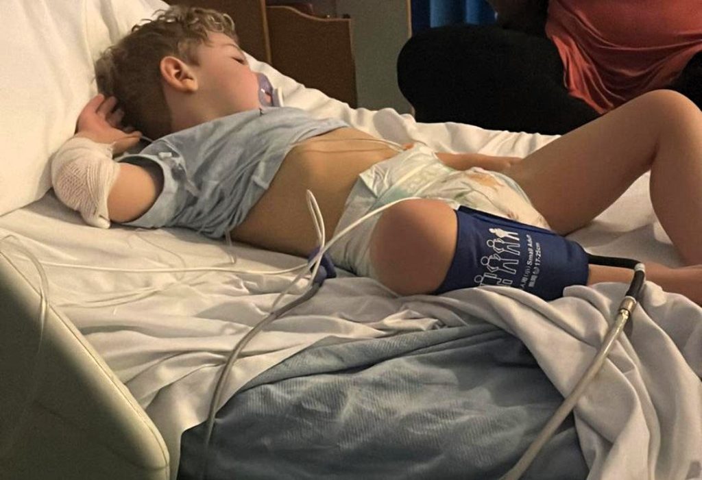 A mum is urging parents to trust their gut after doctors repeatedly dismissed her son's symptoms as constipation and teething - leaving him just hours away from death.