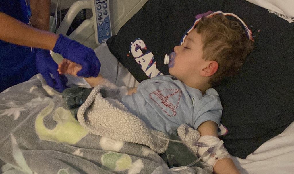 A mum is urging parents to trust their gut after doctors repeatedly dismissed her son's symptoms as constipation and teething - leaving him just hours away from death.