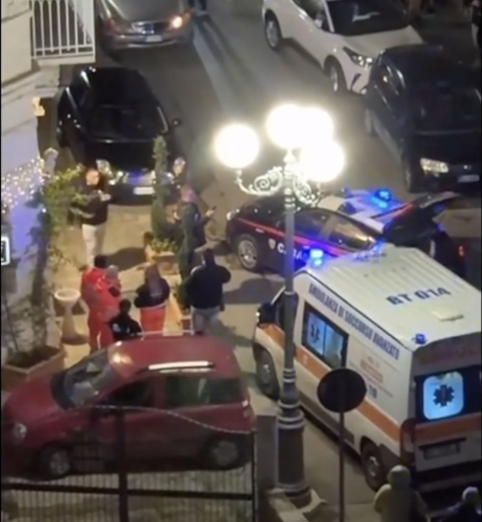 British tourists watched in horror as masked gunmen stormed an Italian restaurant and shot dead a 62-year-old waiter in what investigators believe was a case of mistaken identity.