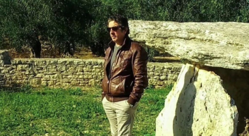 British tourists watched in horror as masked gunmen stormed an Italian restaurant and shot dead a 62-year-old waiter in what investigators believe was a case of mistaken identity.