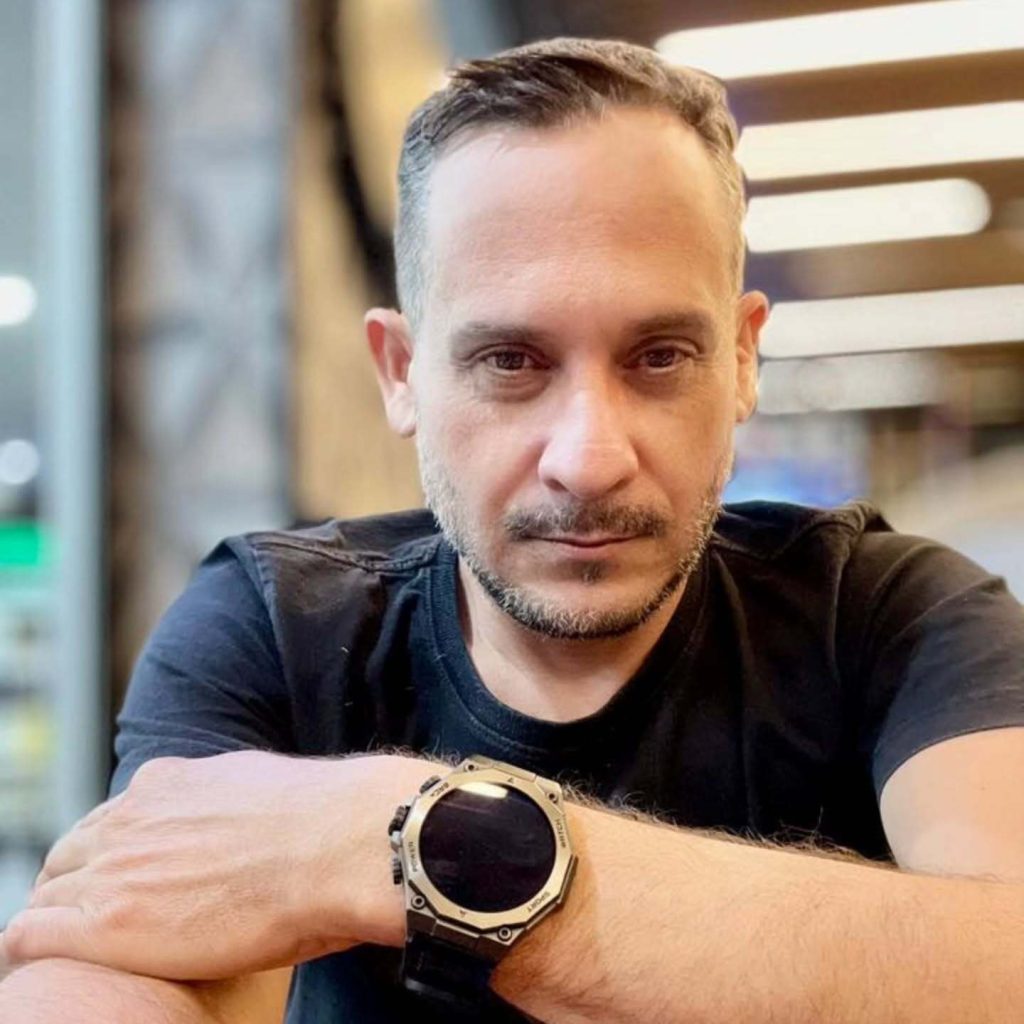 A father of two died during a motorbike test ride after a collision at a junction, leaving his 16-year-old son waiting at the dealership unaware of the tragedy unfolding nearby.