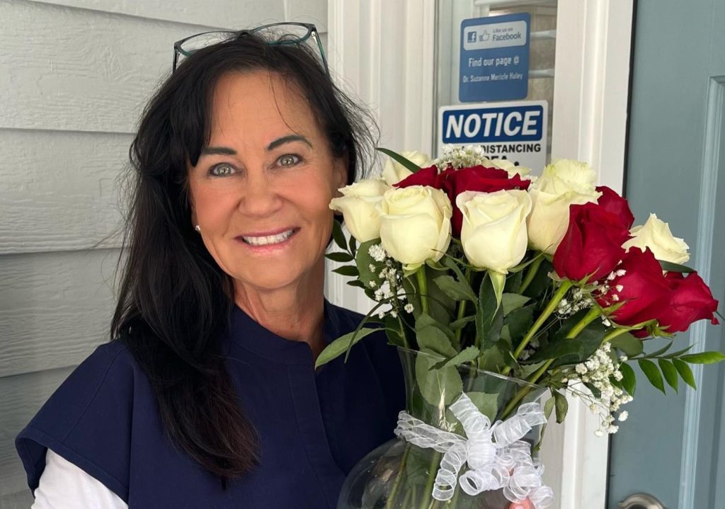 A former dentist was sentenced to life in prison for fatally shooting her boyfriend through a locked bedroom door during a jealous rage over him allegedly sending money to another woman.