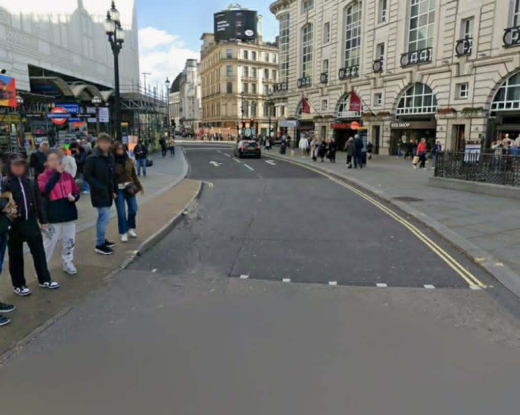 Driver brutally beaten in a shocking road rage attack at Piccadilly Circus - as his car rolls dangerously down the street towards a busy crossing.