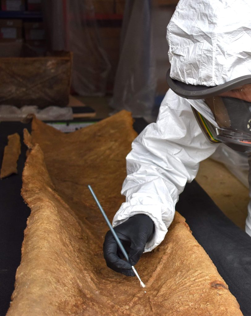 A high-status Roman woman buried in a decorated lead coffin under a Colchester hospital has been unearthed, with frankincense, rare glass vessels and jet hairpins among her grave goods.