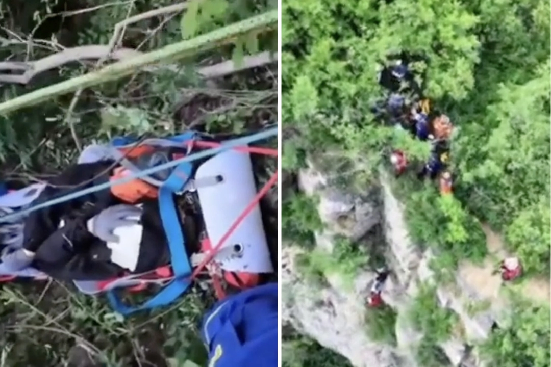 A hiker miraculously survived a 200m cliff fall in China after tree branches broke his descent - with rescuers spending four hours in a dramatic operation to bring him to safety.