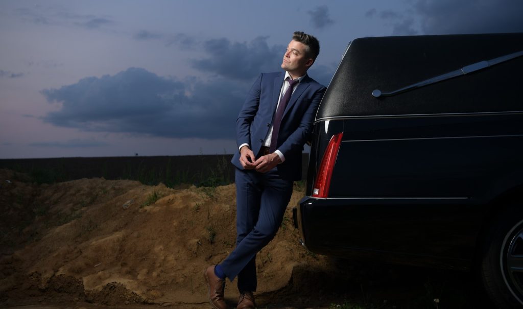A failed musician became a funeral director at 30, only to sell his homes and return to music 13 years later, landing two Billboard hits after going viral on TikTok talking about death.