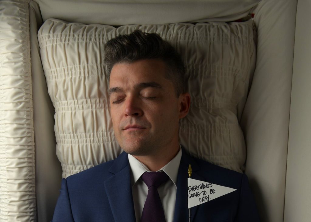 A failed musician became a funeral director at 30, only to sell his homes and return to music 13 years later, landing two Billboard hits after going viral on TikTok talking about death.
