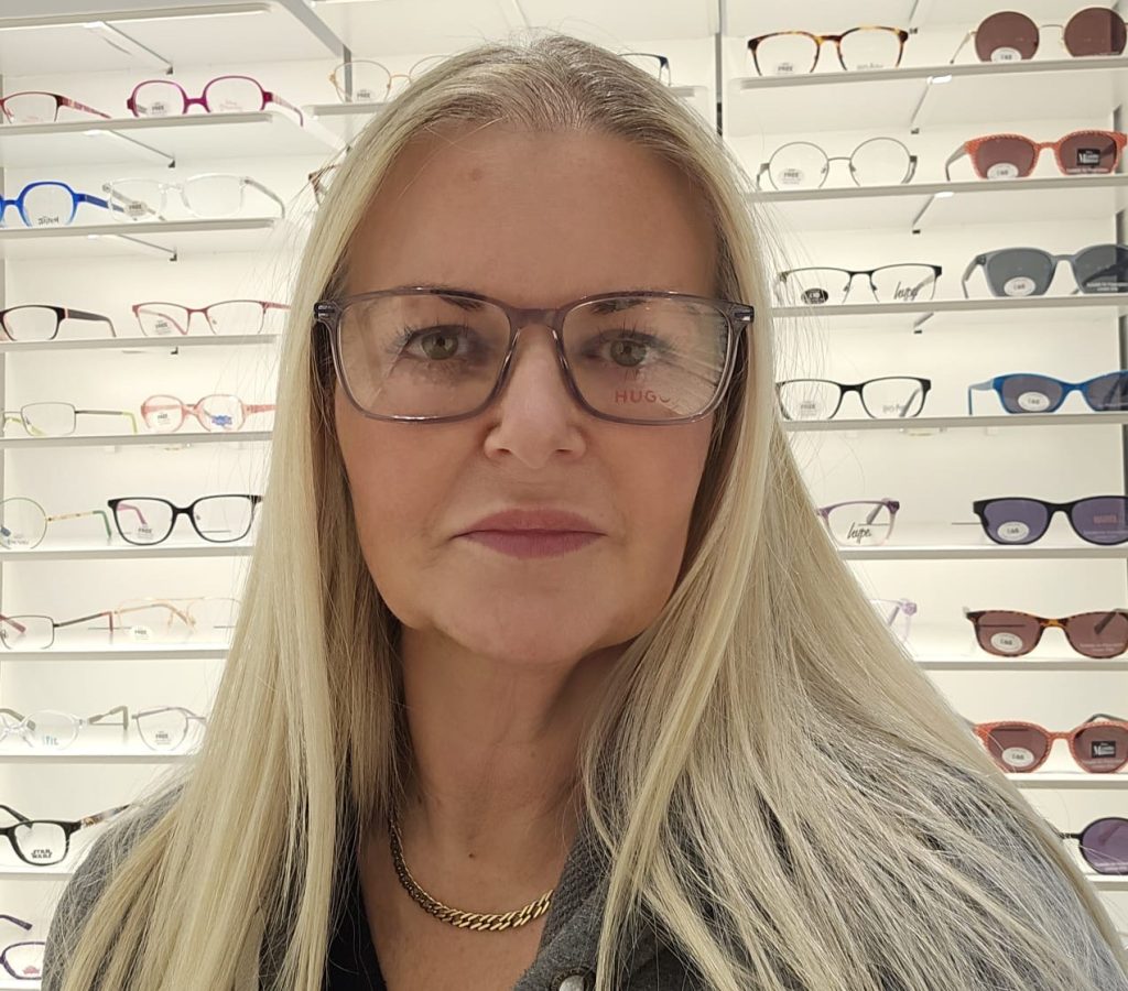 A mum who spent decades unable to see clearly finally saw her son's face properly on his 21st birthday - after life-changing eye surgery transformed her world.