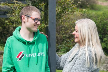 A mum who spent decades unable to see clearly finally saw her son's face properly on his 21st birthday - after life-changing eye surgery transformed her world.
