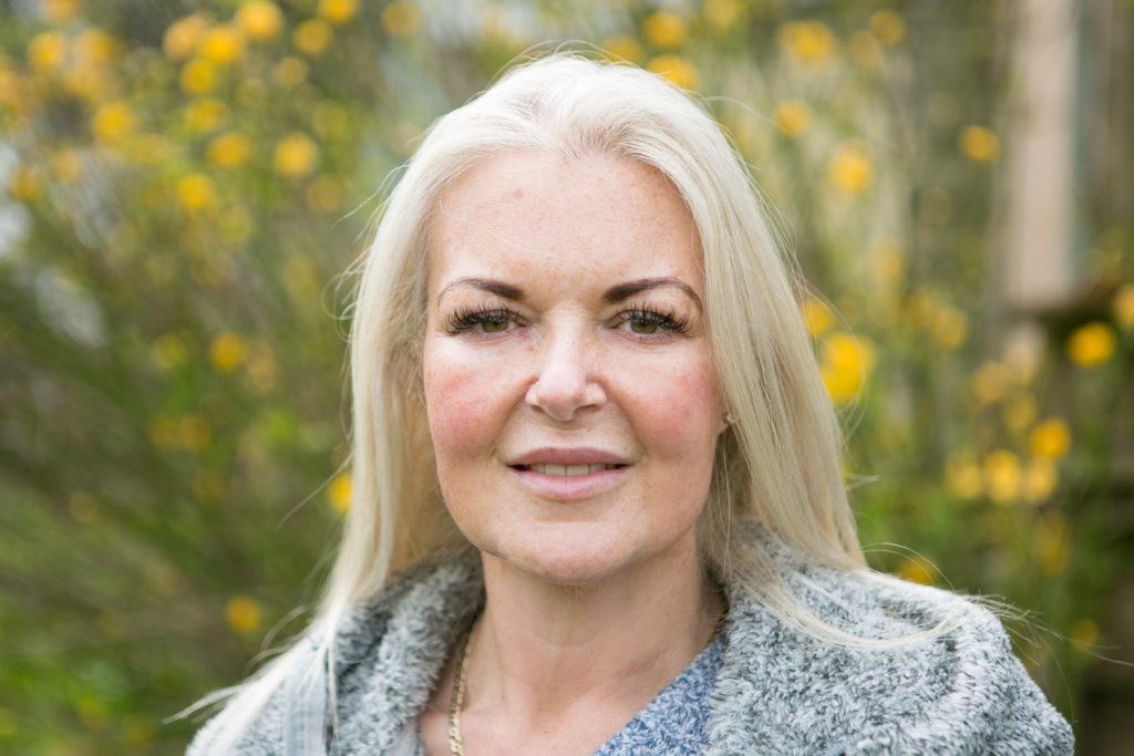 A mum who spent decades unable to see clearly finally saw her son's face properly on his 21st birthday - after life-changing eye surgery transformed her world.