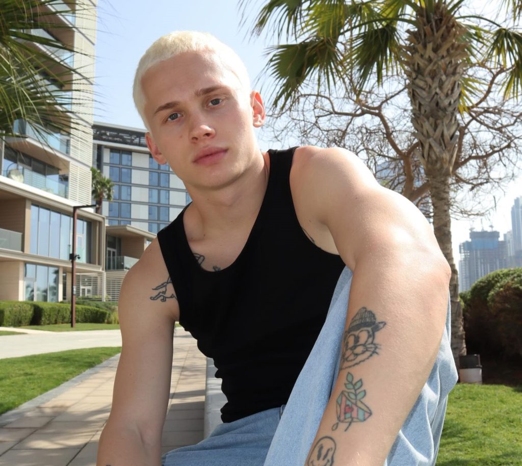 Influencer with over 20 million followers loses one of his front teeth after going down a children's slide at a swimming pool - and the embarrassing reason why.