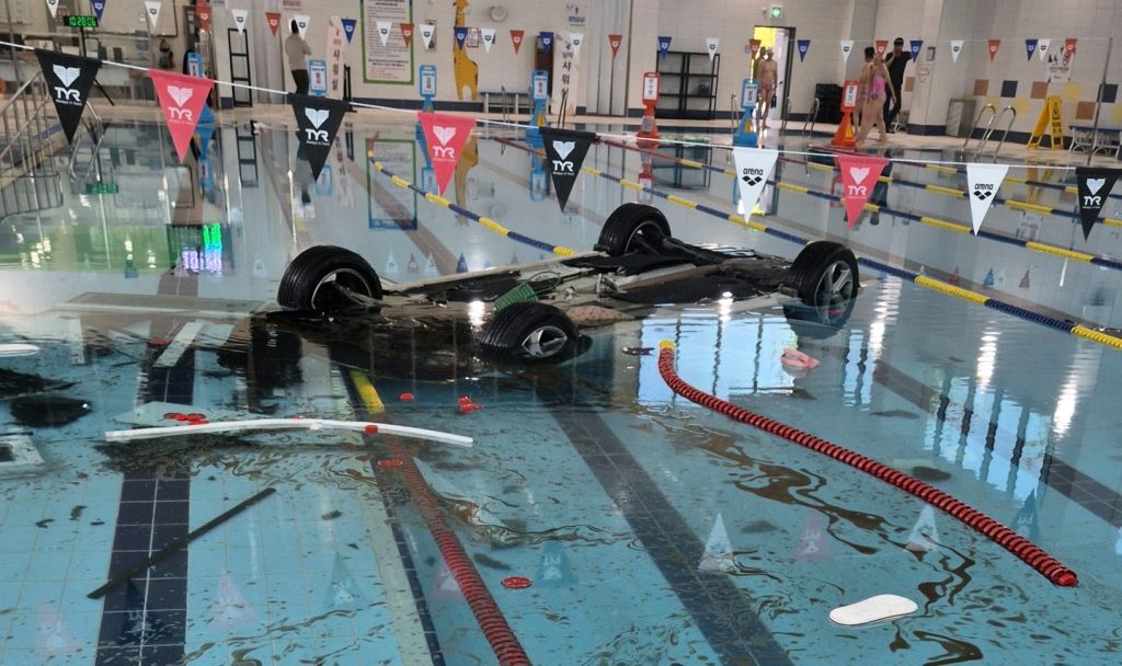 Elderly driver, 74, crashed her car through glass wall plunging 16ft into indoor swimming pool at Hanam Sports Centre, South Korea, rescued by swimmers.