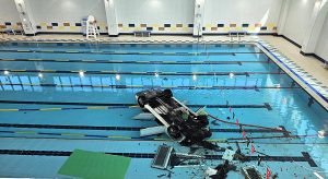 Elderly driver, 74, crashed her car through glass wall plunging 16ft into indoor swimming pool at Hanam Sports Centre, South Korea, rescued by swimmers.