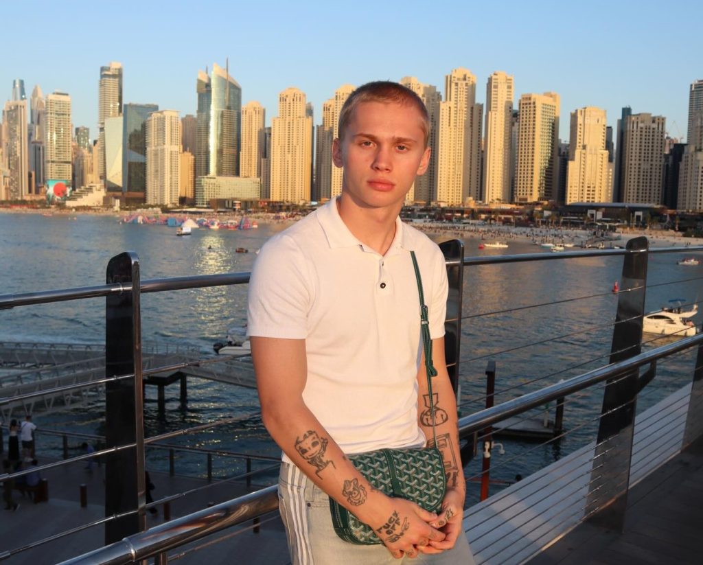 Influencer with over 20 million followers loses one of his front teeth after going down a children's slide at a swimming pool - and the embarrassing reason why.