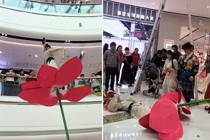 An acrobat plunged 10ft headfirst from a pole at a Chinese shopping centre with no safety mats below, leaving shoppers horrified as she lay motionless on the hard floor.